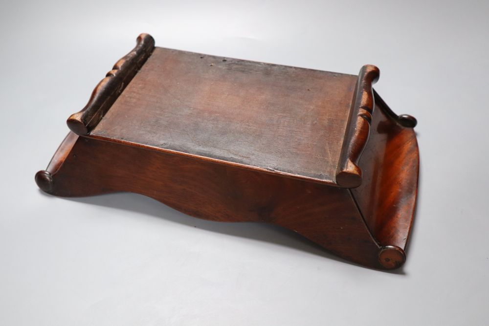 A Victorian mahogany cheese coaster, with scroll ends, 36 x 19cm